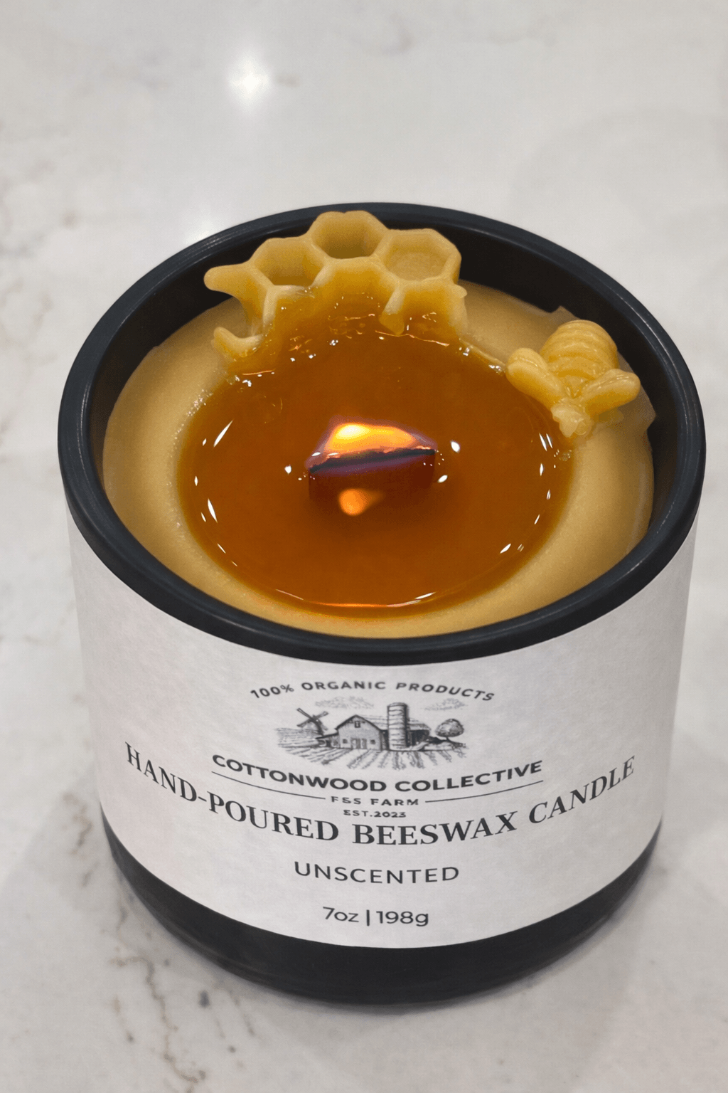 Beeswax wood wick candle burning — crackling flame, clean air, no synthetic fragrance